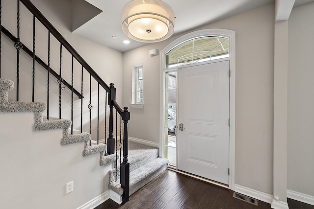 foyer featuring dark wood-type flooring