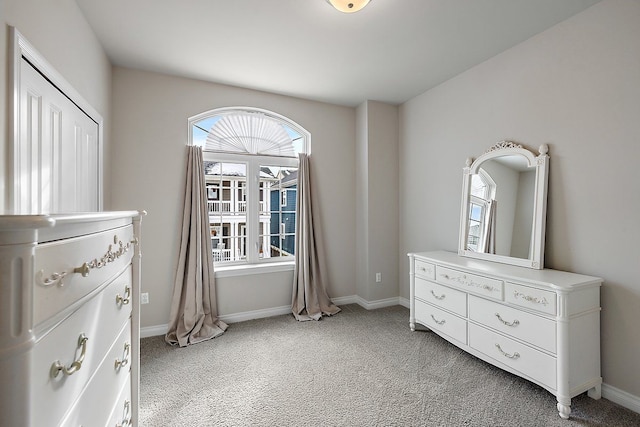 bedroom with light colored carpet