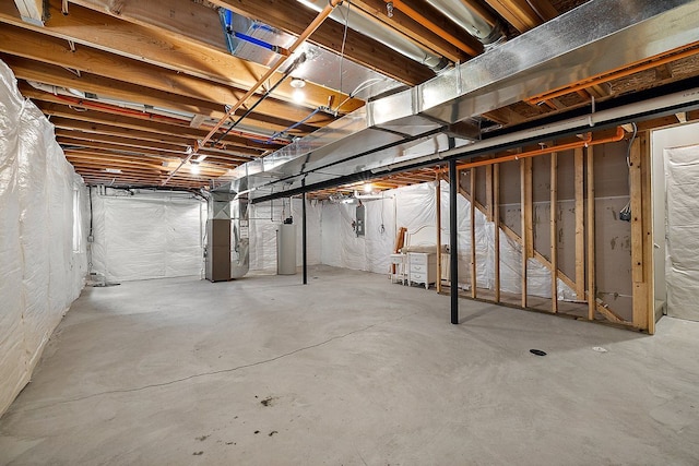 basement with heating unit and water heater