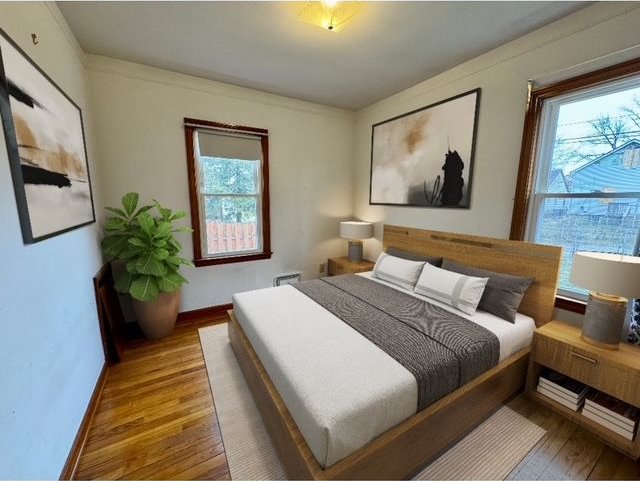 bedroom with wood-type flooring