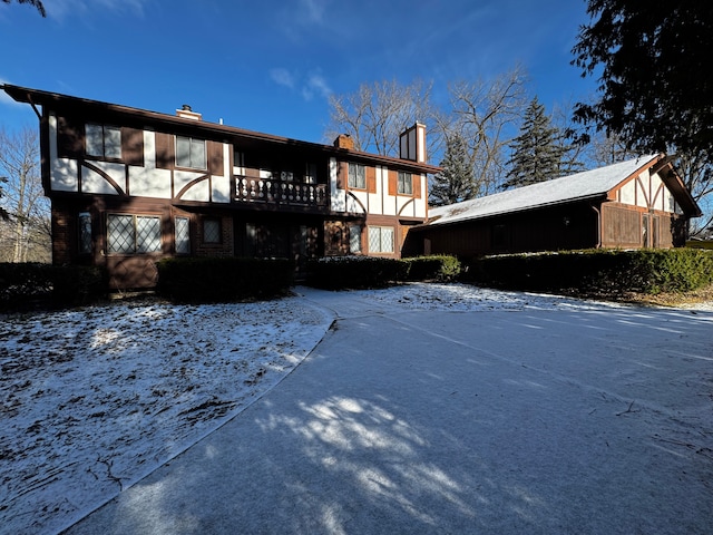 view of snow covered rear of property