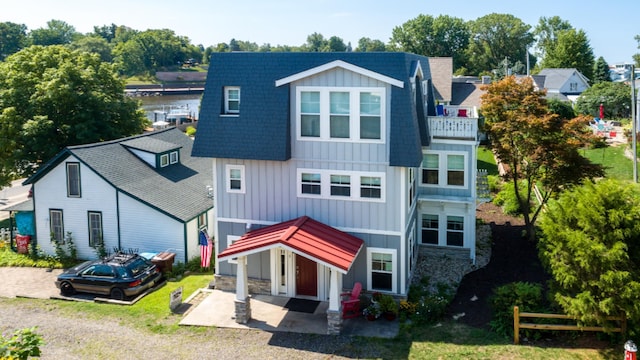 back of house with a garage