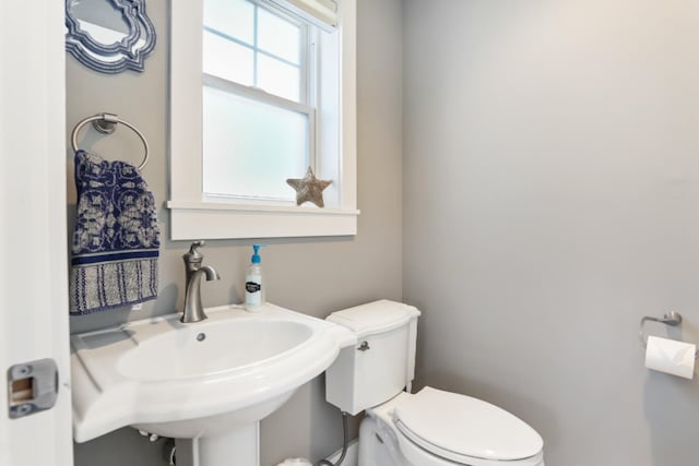 bathroom with toilet and sink