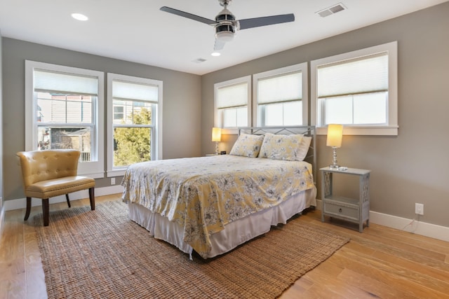 bedroom featuring ceiling fan and light hardwood / wood-style flooring