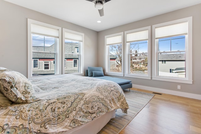 bedroom featuring ceiling fan and light hardwood / wood-style flooring