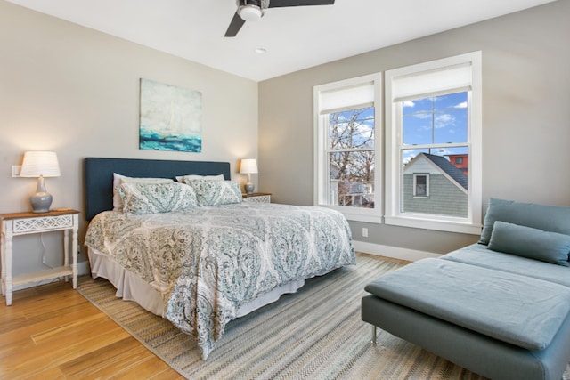 bedroom with hardwood / wood-style flooring and ceiling fan