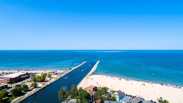 aerial view featuring a view of the beach and a water view