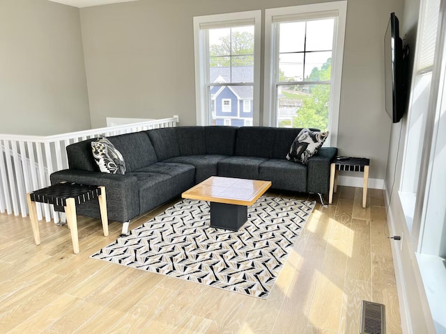 living room with light hardwood / wood-style floors