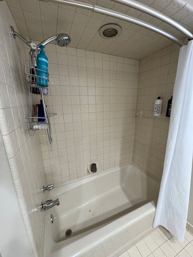 bathroom featuring shower / tub combo with curtain and tile patterned floors