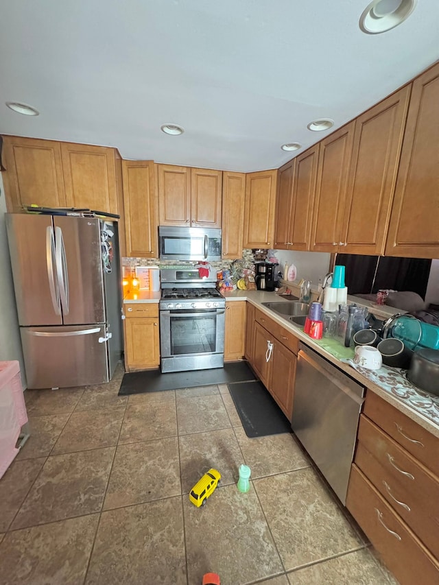 kitchen featuring appliances with stainless steel finishes and sink