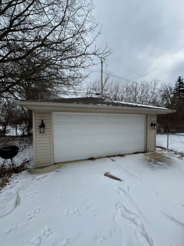 view of snow covered garage