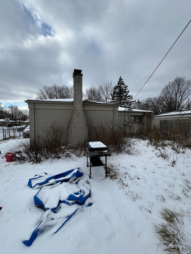 view of yard layered in snow