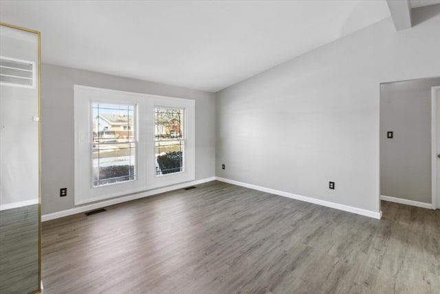 empty room featuring dark hardwood / wood-style flooring