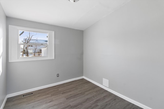 unfurnished room featuring dark hardwood / wood-style floors