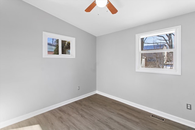 unfurnished room with wood-type flooring, lofted ceiling, and ceiling fan