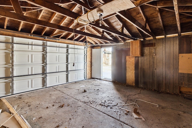 garage featuring wooden walls