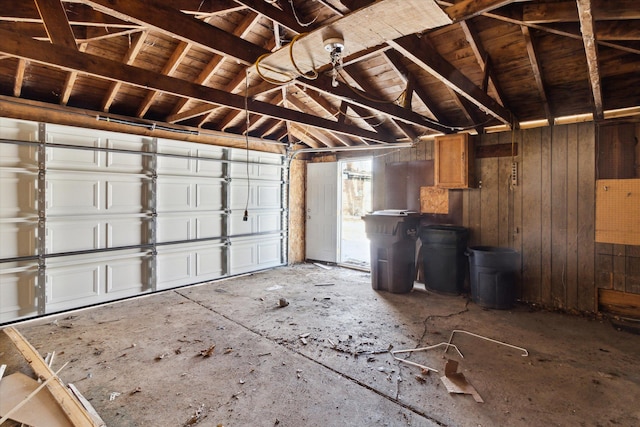 garage featuring wood walls