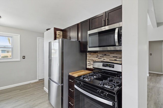 kitchen featuring stainless steel appliances, tasteful backsplash, dark brown cabinetry, and light hardwood / wood-style floors