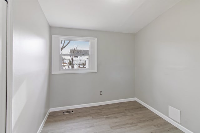 empty room with light wood-type flooring