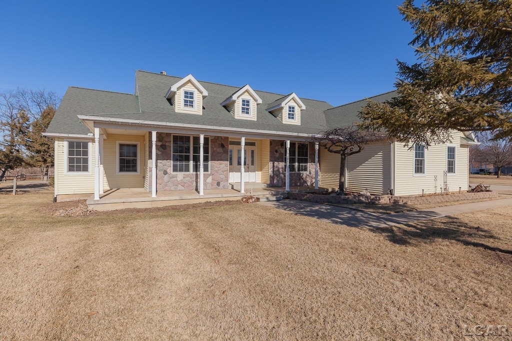 cape cod-style house with a porch and a front yard