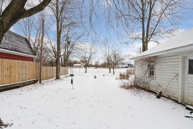 view of yard layered in snow