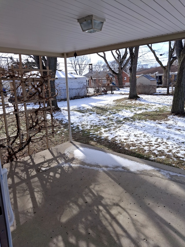 view of snow covered patio