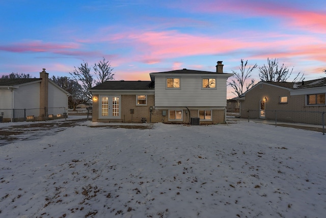 back house at dusk with french doors