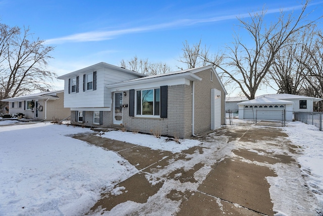 split level home featuring a garage and an outdoor structure