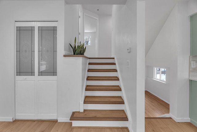 staircase featuring hardwood / wood-style flooring