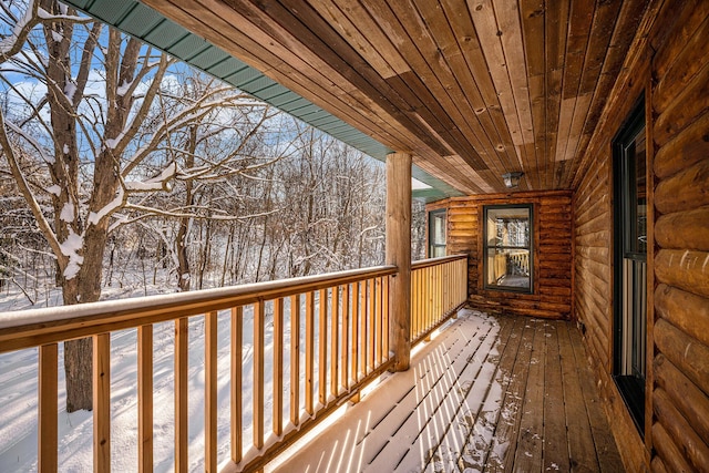 view of snow covered deck