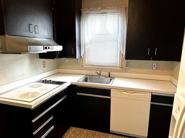 kitchen with white appliances and sink