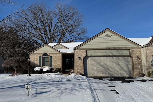 ranch-style house featuring a garage