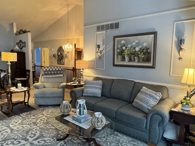 living room with lofted ceiling and a chandelier