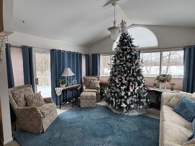 carpeted living room featuring lofted ceiling