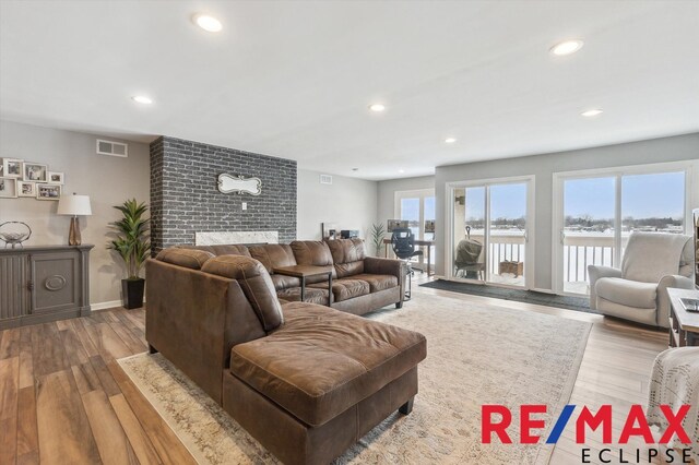 living room with light hardwood / wood-style flooring