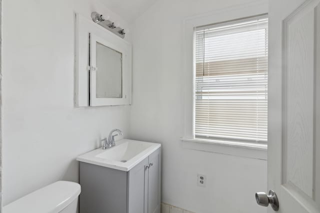 bathroom featuring vanity and toilet