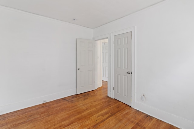 spare room with wood-type flooring