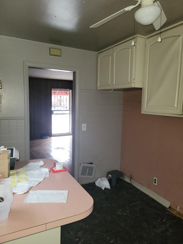 kitchen featuring tile walls