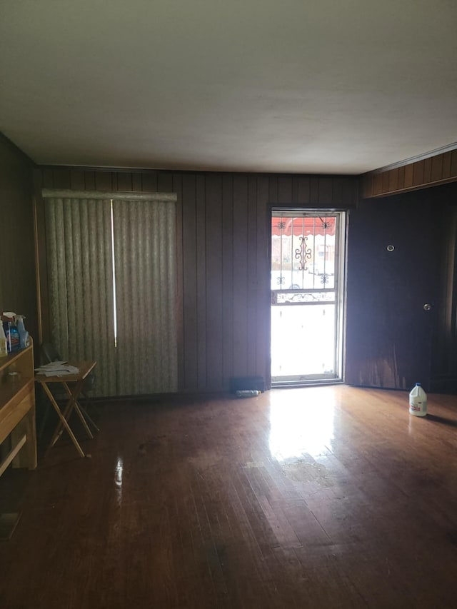 spare room featuring wood-type flooring