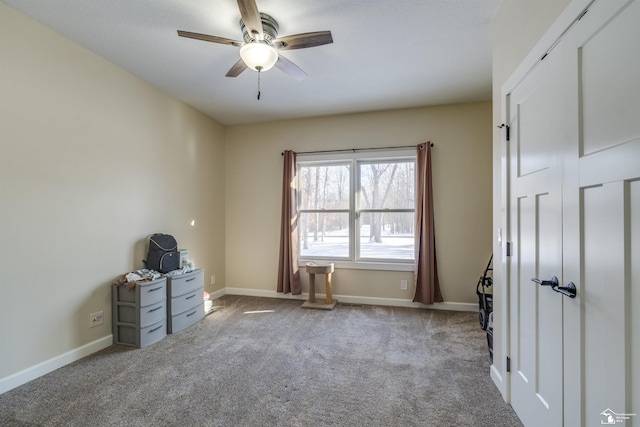 miscellaneous room featuring ceiling fan and carpet