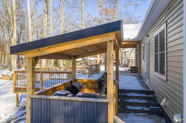 view of snow covered deck