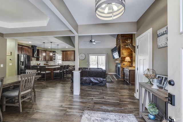 interior space with ceiling fan and dark hardwood / wood-style floors