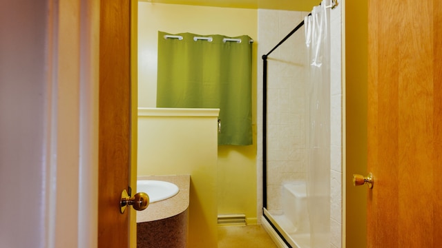 bathroom featuring sink and curtained shower