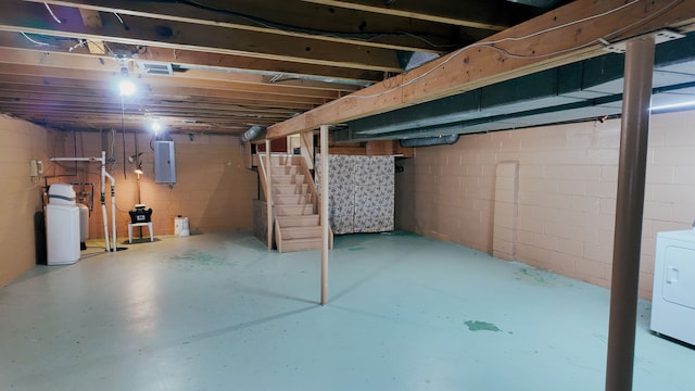 basement with washer / clothes dryer and electric panel