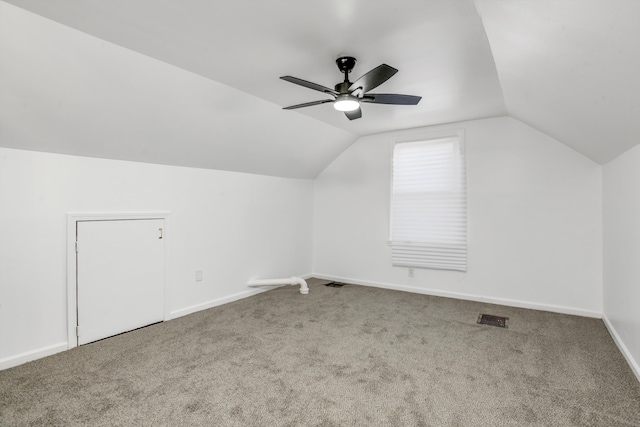 additional living space with ceiling fan, carpet floors, and vaulted ceiling