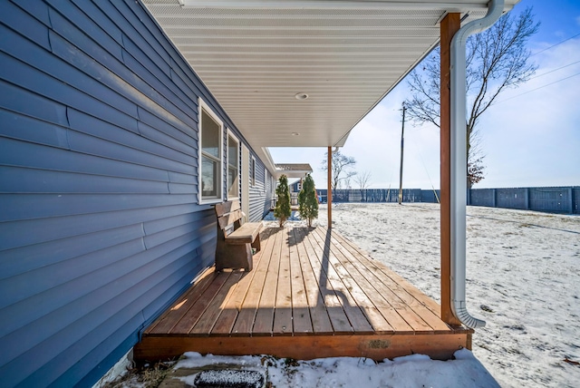 view of snow covered deck
