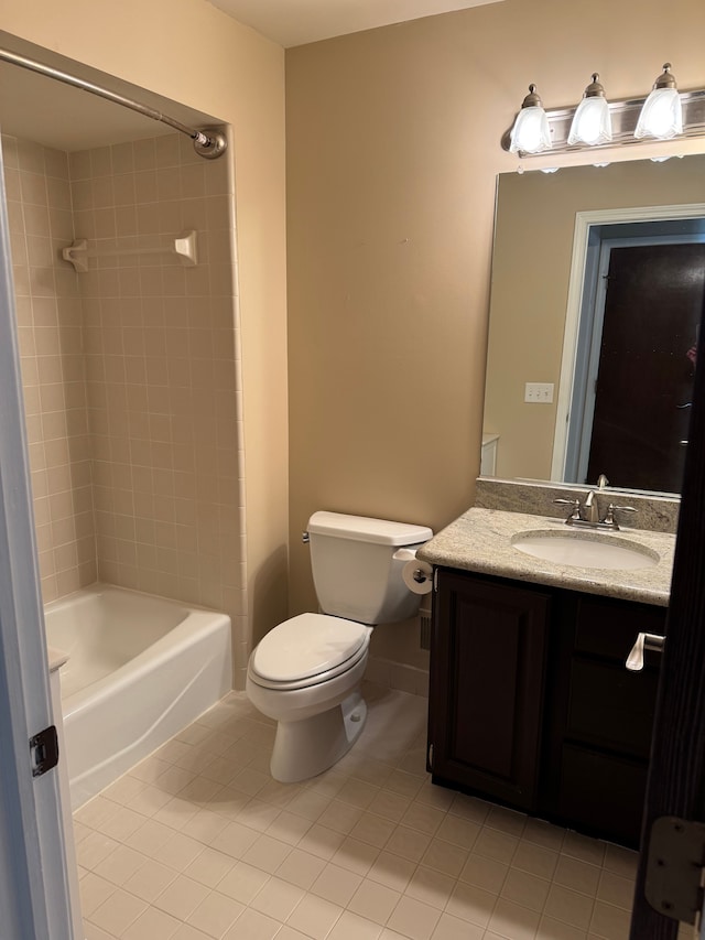 full bathroom featuring vanity, bathing tub / shower combination, tile patterned floors, and toilet