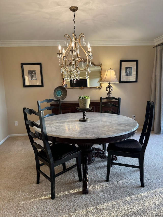 dining area featuring ornamental molding and carpet