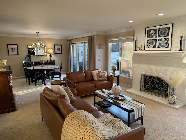 carpeted living room featuring a notable chandelier, crown molding, and a brick fireplace