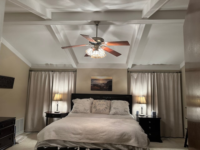 carpeted bedroom featuring ceiling fan and vaulted ceiling with beams